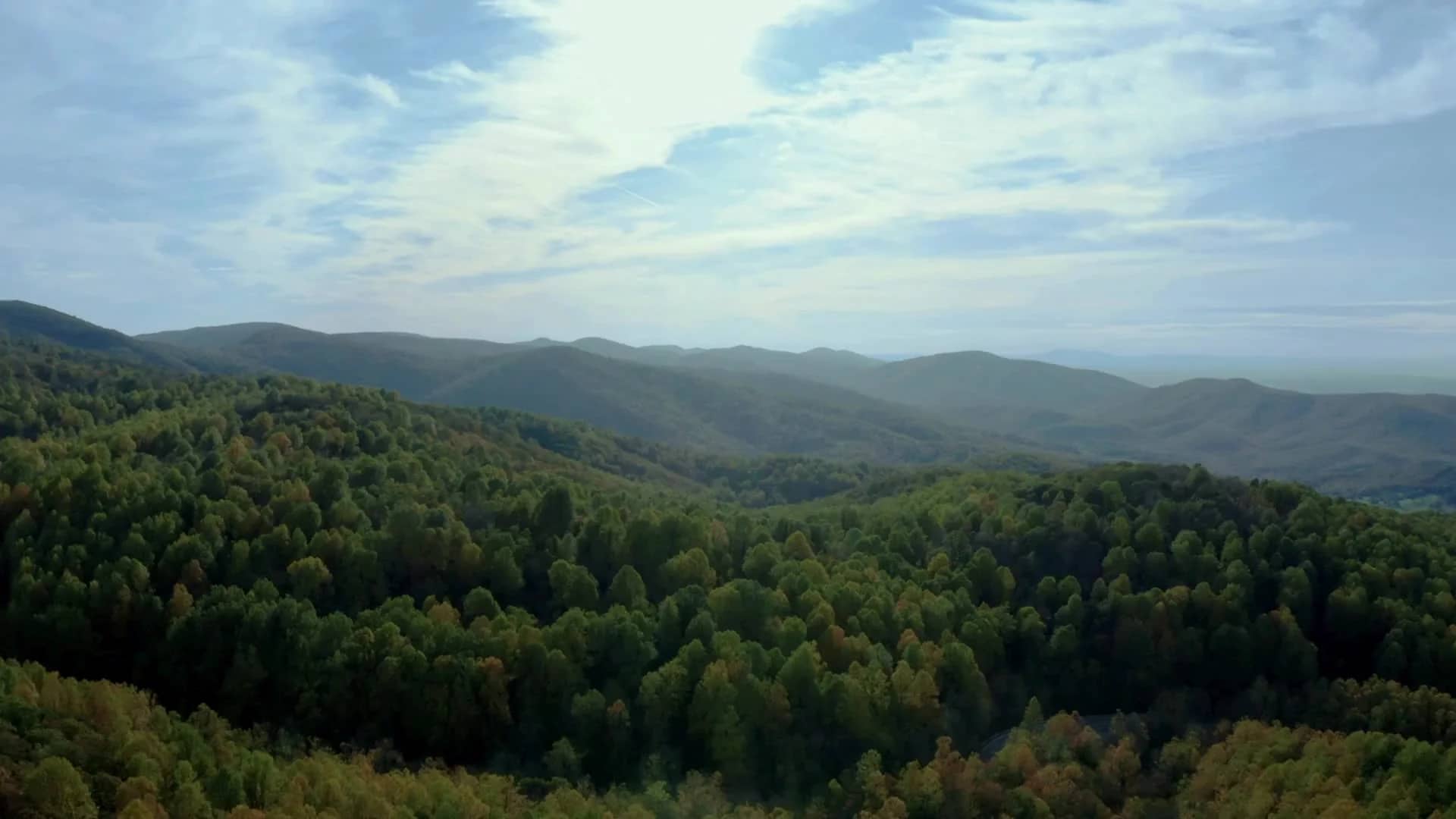 The Shenandoah Valley in summer, farms and wooded hills under a wide sky